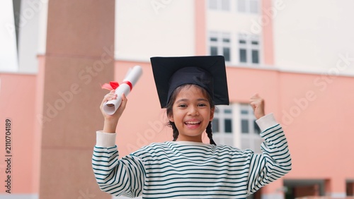 Принти на полотні Happy group of young kids children graduating and celebrating success with graduation caps and diplomas