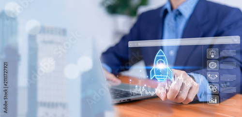 Fotografie Business professional launching a virtual startup rocket on a digital dashboard with analytics, growth chart, and strategy icons, representing innovation, business development, digital transformation