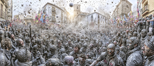 Crowds covered in black paint during the Cascamorras festival in Baza