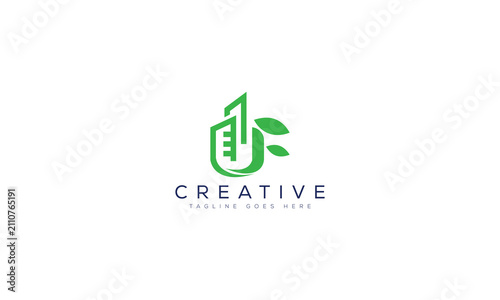 Green building logo design with leaf elements