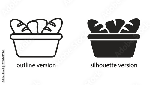 Obraz na płótnie Basket of Bread, Outline and Silhouette: A graphic representation of a basket filled with bread, shown in both an outline and silhouette version, symbolizing baked goods and bakery products
