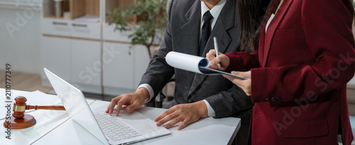 Lawyer businessman and two business partners working together in office.