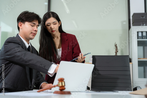 lawyer team signing legal documents, filling court records, and managing contracts in a modern office with collaboration, compliance, and justice.