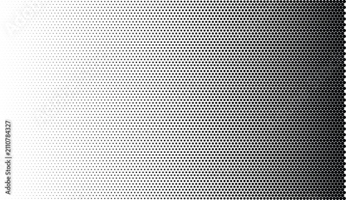 Black and white halftone gradient pattern with circular dots, transitioning from sparse white to dense black on a white background