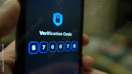 Smartphone screen with verification code close-up in dark room. Entering and confirming verification code 