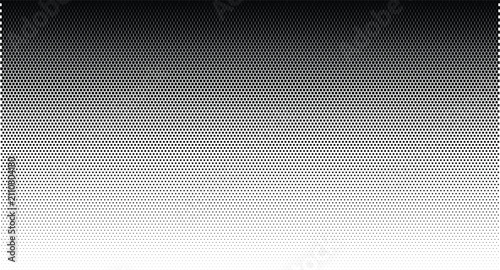 Fotografía Black and white halftone vertical gradient pattern, with circular dots transitio
