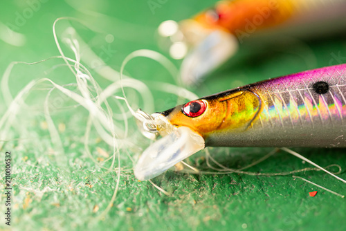 Canvas Print Golden and pink fishing lures The Concept of patience and hobbies
