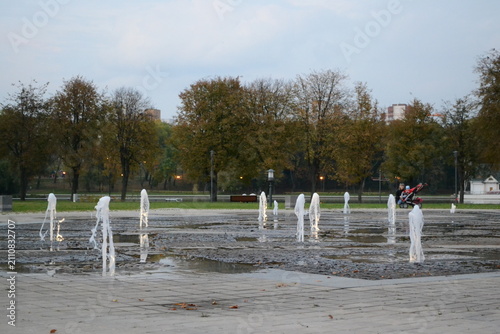Park in the evening, fountains, lake, river