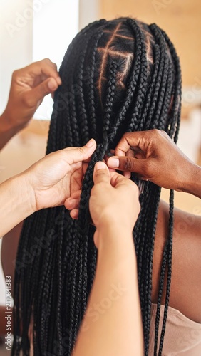 Close Up of Hands Styling and Braiding Black Hair into Box Braids