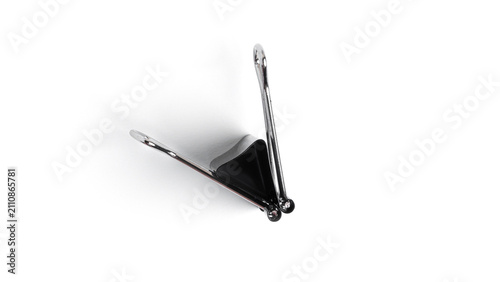 Black metal binder clips on white background. High quality photo