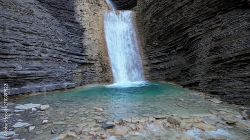 Forward reveal aerial shot of Oros Bajo waterfall. Huesca, Aragon, Spain.