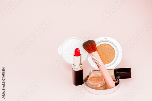 фотографія Soft Focus Makeup Set with Lipstick and Powder Puff and Brush.