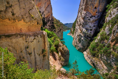 Spectacular view of the Congost de Mont-rebei, a dramatic limestone gorge carved by the Noguera Ribagorçana River in the Montsec mountain range, Catalonia, Spain. The famous cliffside hiking trail off
