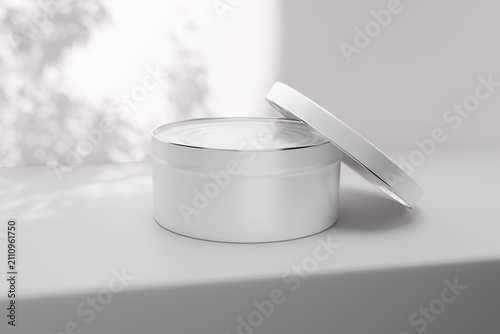 Obraz na płótnie Cosmetic tin jar mockup with open lid leaning on container, blank white round me