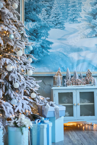 Frosted Christmas Tree, Miniature Village, and Winter Mural Backdrop