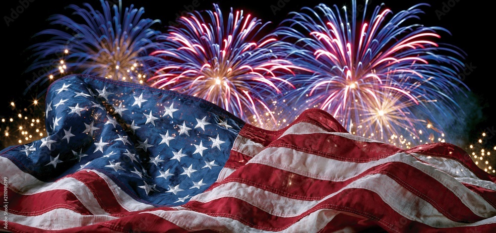 Fototapeta premium Independence Day celebration with colorful fireworks and a waving flag, ideal for patriotic campaigns.