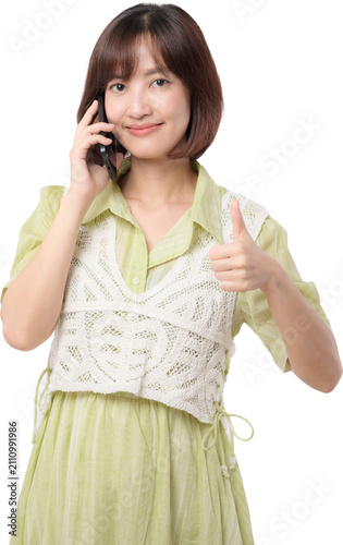 Happy smiling asian woman talking smartphone showing thumb up sign isolated transparency background cheerful model gesture call phone conversation user approval positive. PNG file format