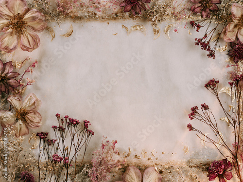 Floral Frame of Dried Flowers and Gold Leaf on Neutral Background