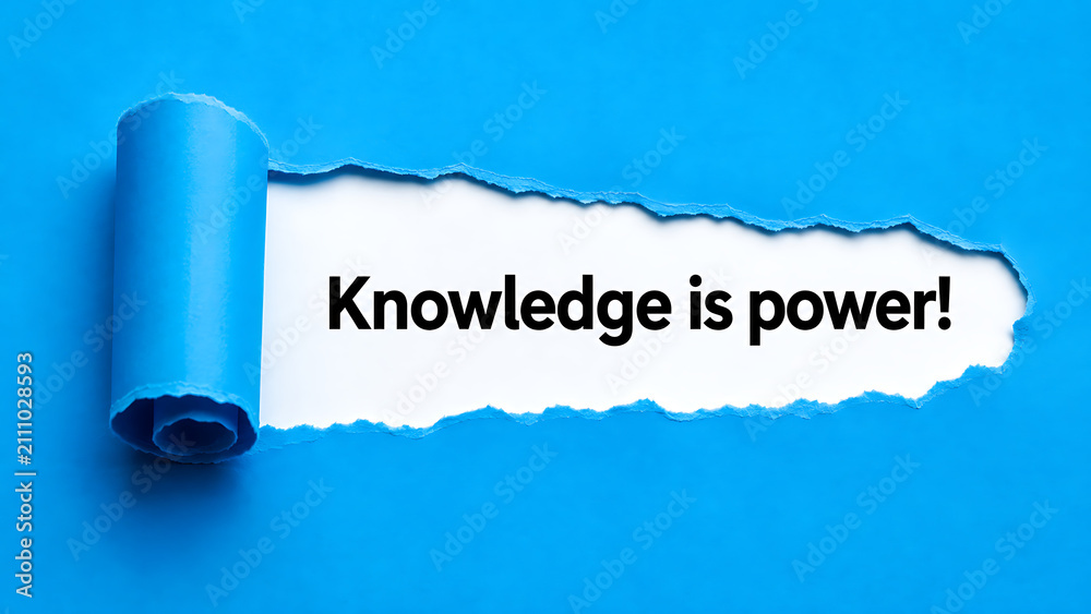 Fototapeta premium Torn paper reveal with the message knowledge is power on a blue background