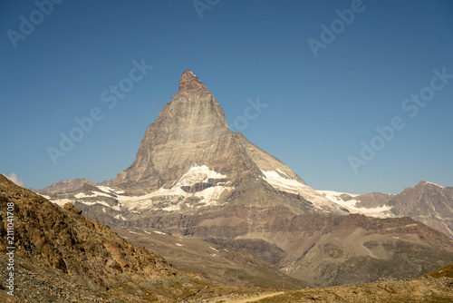 Majestic Matterhorn peak reflection in Riffelsee lake near Gornergrat, Zermatt, Swiss Alps in summer