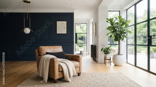 Modern living room interior with leather armchair and dark blue wall