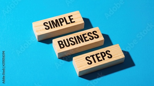 Simple business steps written on wooden blocks with business strategy planning development management professional