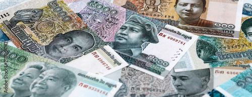 Photography Cambodian riel money banknotes pile on table