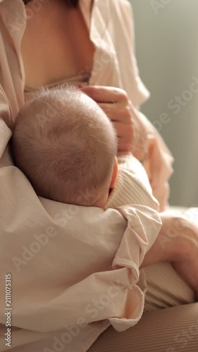 Nurturing mother breastfeeding her newborn baby, a close up showcasing the intimate bond, infant care, motherhood love, and the tender moments of parenting in a calm home environment