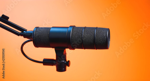 studio microphone isolated on a orange background, professional studio condenser microphone