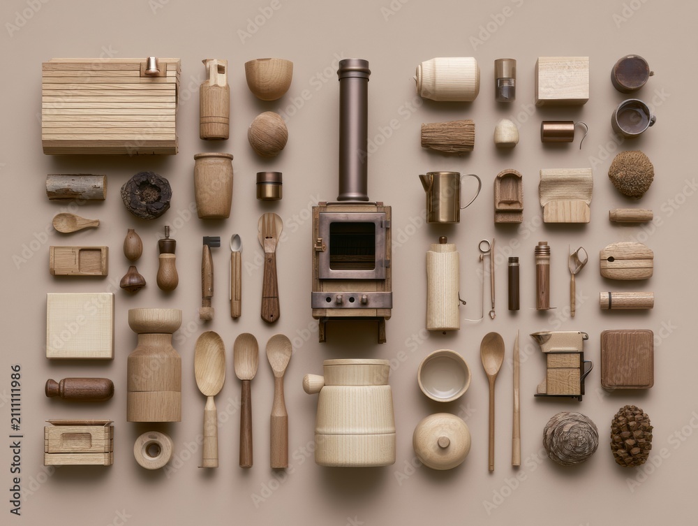 Obraz premium A collection of wooden items centered around a small fireplace unit shows a cozy cabin kit. Autumn tones create a warm feel in the layout.