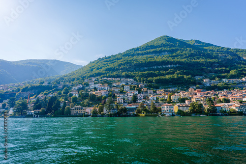 Canvas Print Scenic view of Carate Urio, Italy, featuring colorful houses along the lakeshore