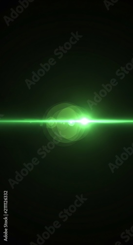 Glowing green light streak in dark space.