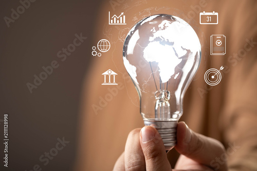 Foto Global business innovation concept with a world map inside a light bulb, representing strategic planning, international growth, digital transformation, economic development, global market expansion