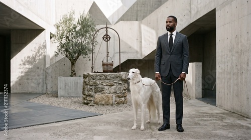 Well-Dressed Man with White Dog in Modern Courtyard