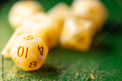 Tableau sur toile Polyhedral dice scattered on green surface The Concept of tabletop roleplaying