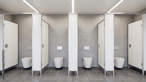 Modern public restroom with clean toilet cubicles interior