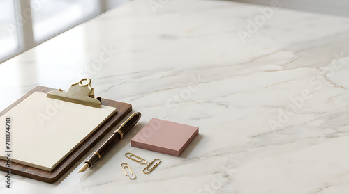 Clipboard with blank paper lies on a white marble desk alongside a fountain pen and sticky notes.
