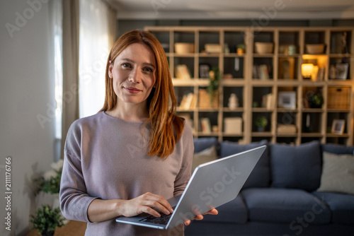 Woman working remotely at home with laptop
