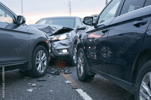 The Car Collision Scene: Dramatic Front End Crash Amidst Crushed Debris On Highway