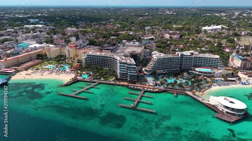 Nassau, Bahamas: Aerial view of turquoise sea, white sand beach and coastal road on New Providence island - landscape panorama of the Caribbean from above
