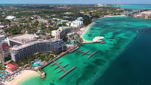 Nassau, Bahamas: Aerial view of turquoise sea, white sand beach and coastal road on New Providence island - landscape panorama of the Caribbean from above

