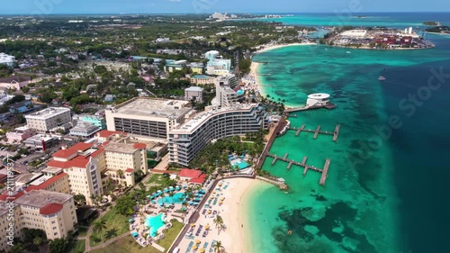Nassau, Bahamas: Aerial view of turquoise sea, white sand beach and coastal road on New Providence island - landscape panorama of the Caribbean from above
