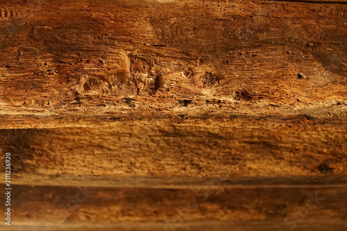 Foto Close-Up of Weathered Wood Damaged by Woodworm with Natural Grain Texture