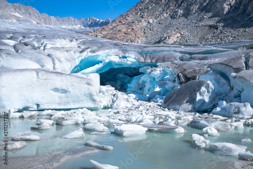 фотографія Blue Ice and Meltwater on Melting Rhone Glacier in Swiss Alps
