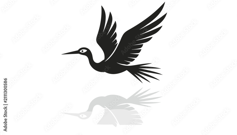 Obraz premium Elegant black silhouette of a flying stork bird soaring with outspread wings and its soft grey shadow reflection below.