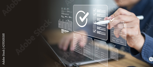Corporate overseeing digital document management ensuring strict compliance during routine workflow inspecting detailed checklist needing final approval.