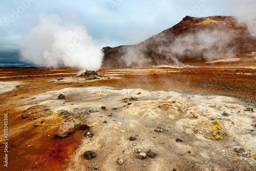 Fotografie Geothermal landscape with steaming fumaroles at Namaskard Iceland