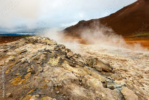Obraz na plátně Geothermal landscape with steaming fumaroles at Namaskard Iceland