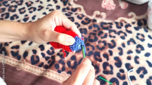 Woman holding fresh red and blue raspberries in hand, ripe berries harvest, summer nature.