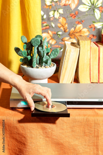 Inserting a CD disc into a DVD player